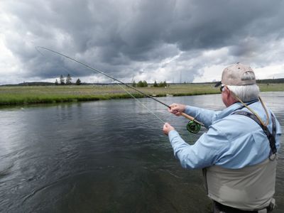 mark hooked up with a Firehole brown trout